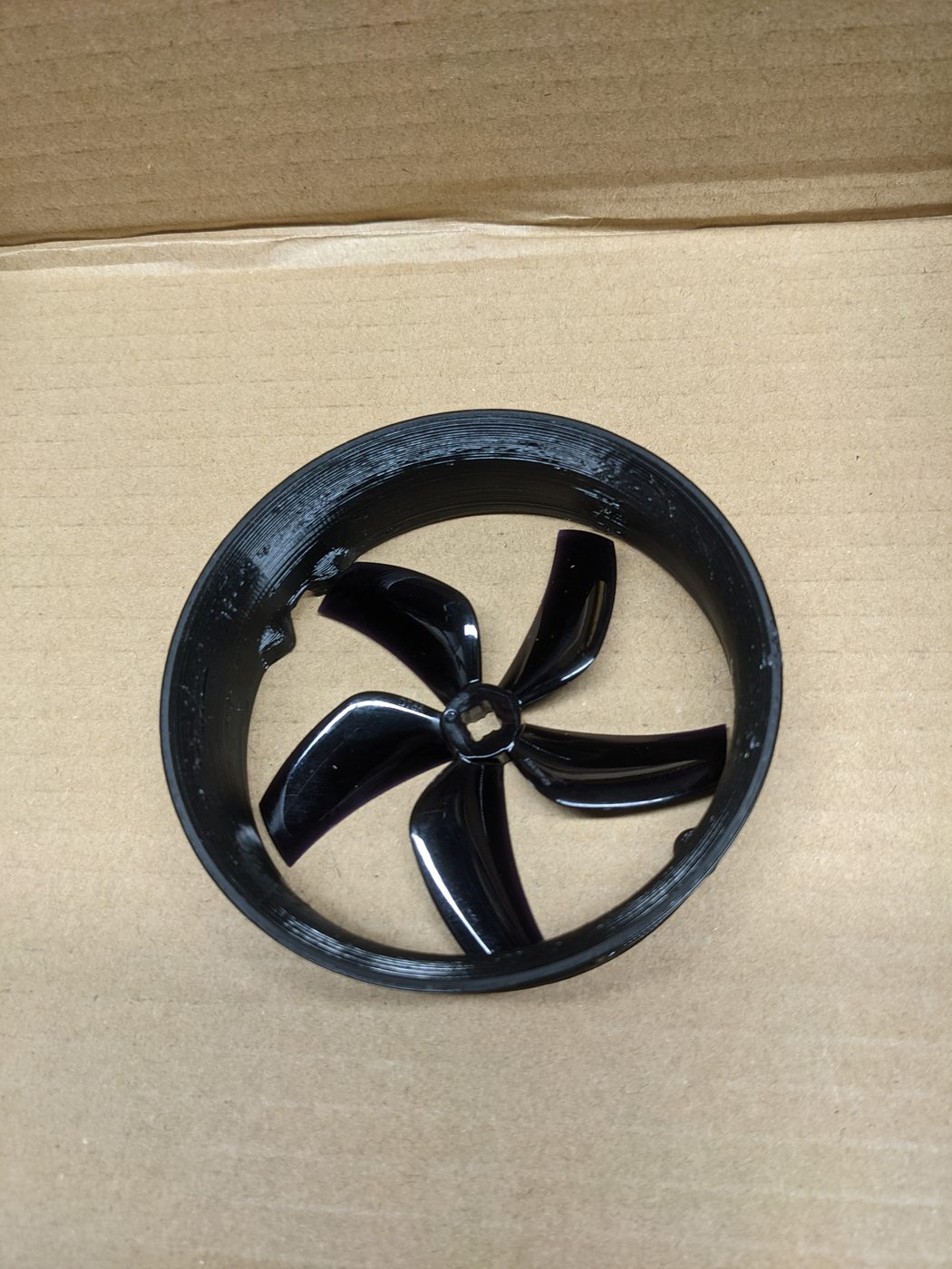 Black 3D-printed ducted fan with five-bladed impeller