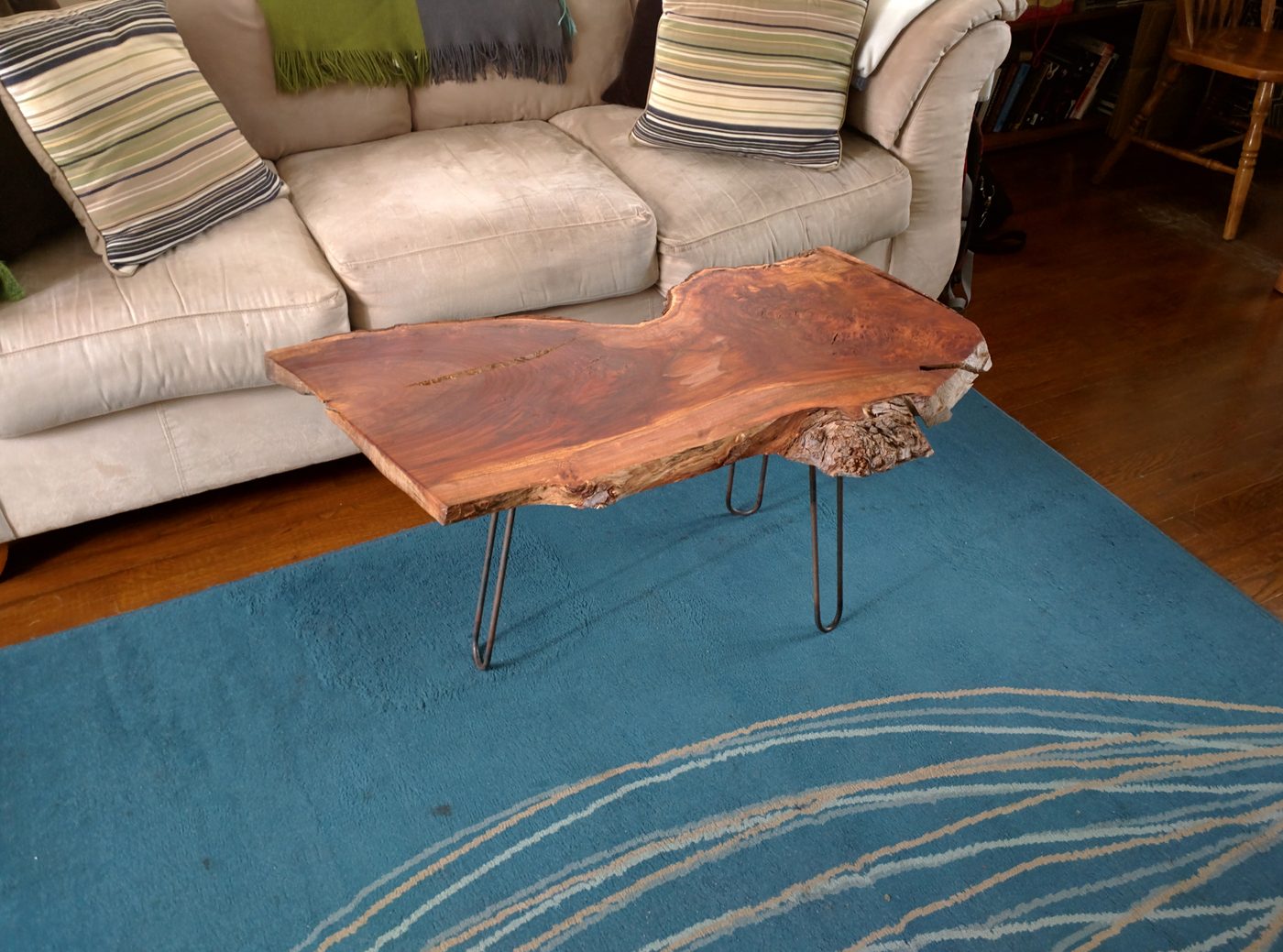 Live-edge wood coffee table on hairpin legs
