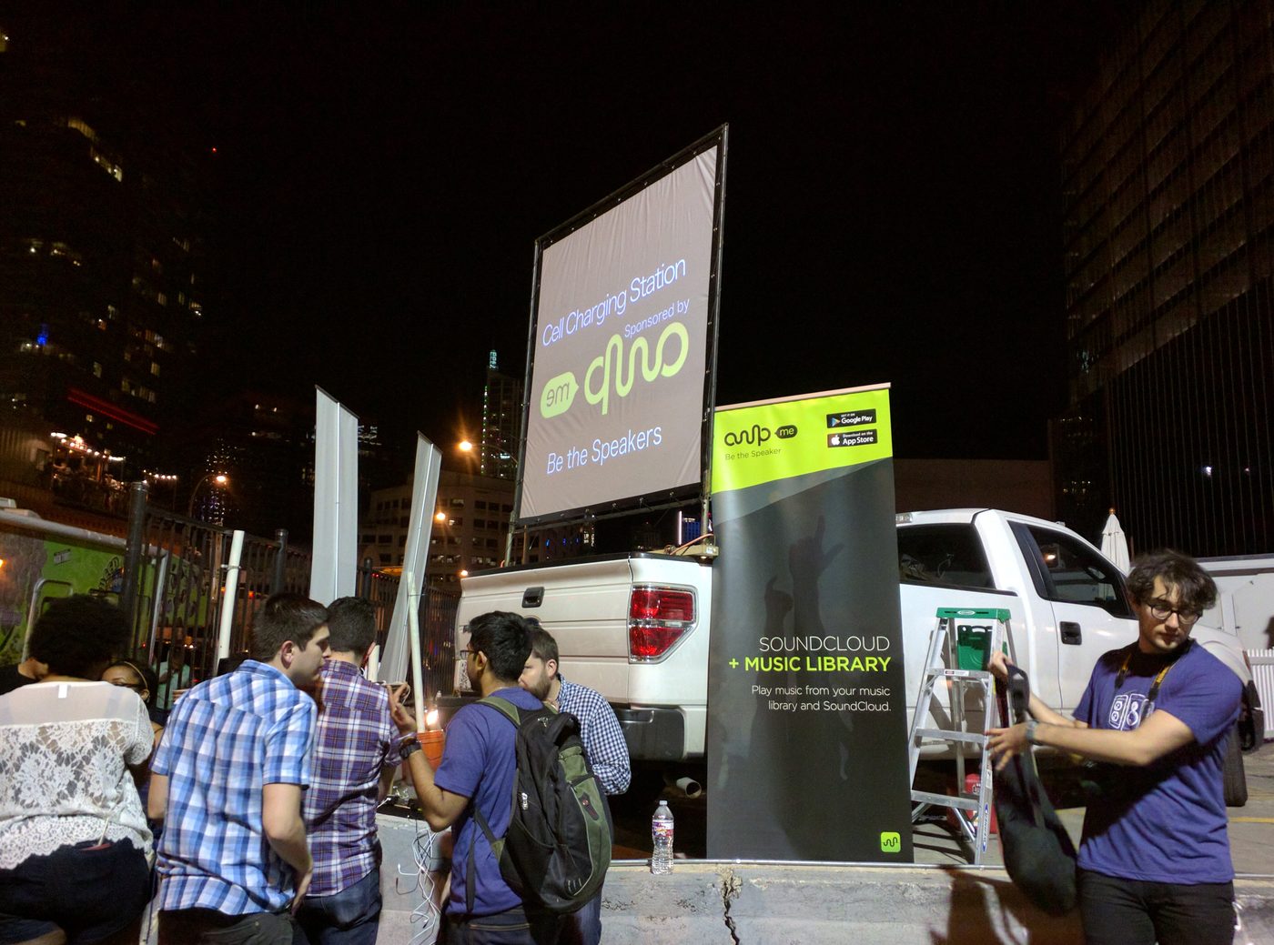 Charging station with a crowd at night