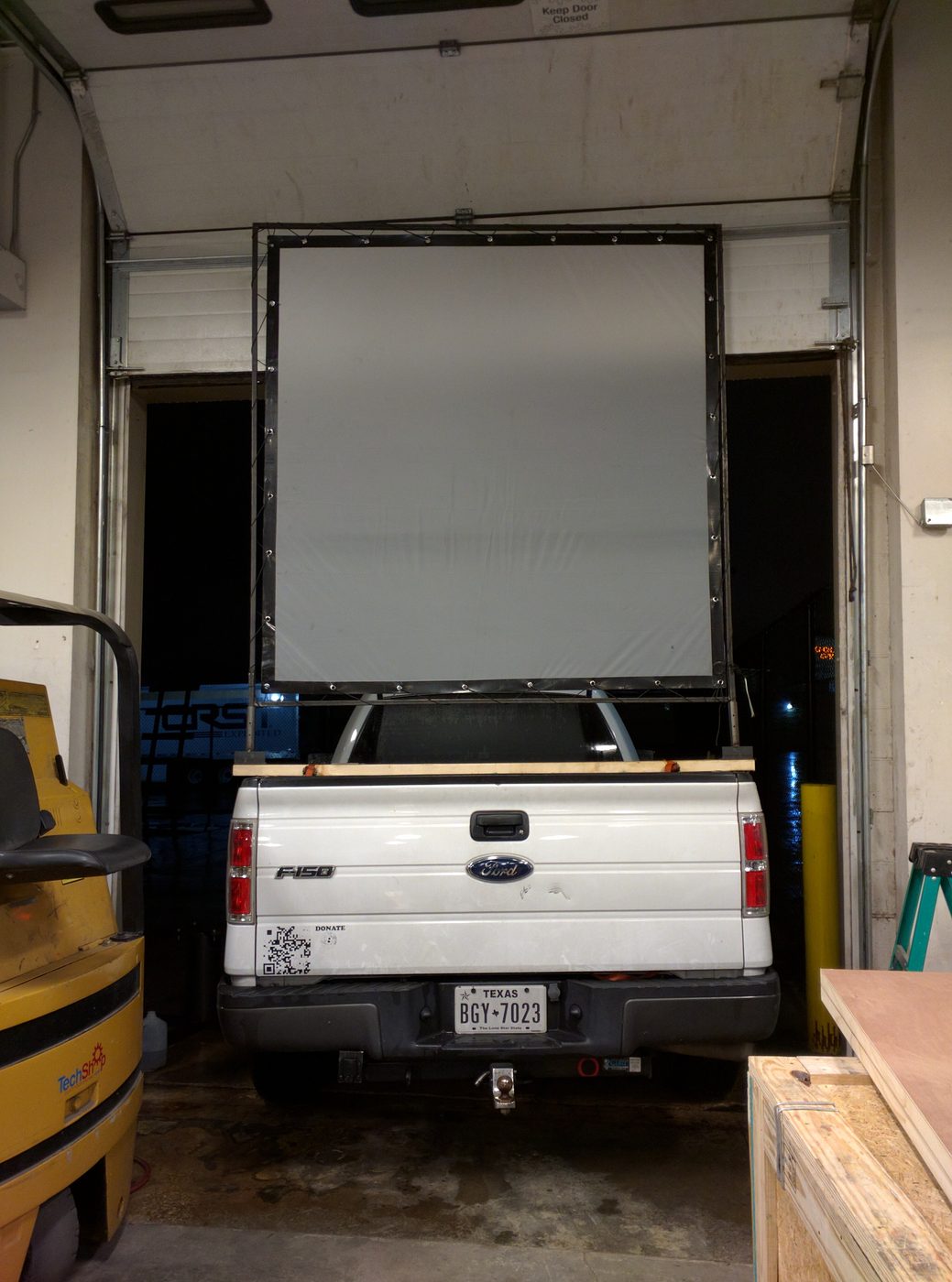 Projection screen mounted on a pickup truck