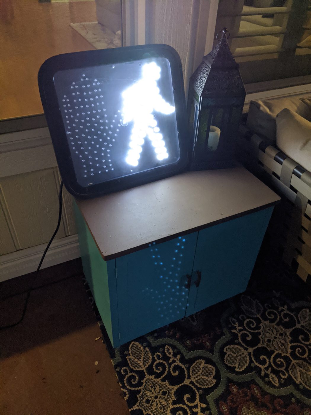 Pedestrian signal lit up with the walking figure